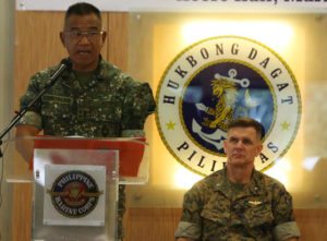 AMPHIBIOUS EXERCISES Philipppine Marines commandant Maj. Gen. Andre Costales Jr. (left) delivers his remarks during the opening rites for joint amphibious exercises between Filipino and US marines at Fort Bonifacio in Taguig City. Behind him is Brig. Gen. John Jansen of the US Marines’ 3rd Expeditionary Brigade. PHOTO BY RENE H. DILAN