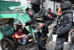 SHOOTOUT AT ISLAMIC CENTER Photo shows the body of a dead man inside a pedicab following a raid by police at the Manila Islamic Center on Friday. The operation left seven people, including a barangay (village) chairman, dead. PHOTO BY RENE H. DILAN