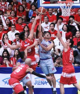 OUTNUMBERED Arellano U’s Michael Cañete attempts an under goal shot against the defense of San Beda players Javee Mocon (9), Benedict Adamos (18) and Davon Potts (16) during Game 2 of the best-of-three finals of the NCAA Season 92 men’s basketball tournament at the Mall of Asia Arena in Pasay City on Tuesday. PHOTO BY BOB DUNGO JR.