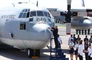 SYMBOL OF FRIENDSHIP US Ambassador to Manila Philip Goldberg pours champagne on the C-130T cargo plane that was turned over to the Philippine Air Force on Monday. PHOTO BY RENE H. DILAN 