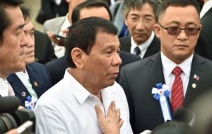 Philippine President Rodrigo Duterte answers questions following his inspection of Japan's coast guard drills in Yokohama. AFP Photo