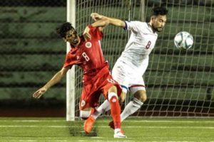 Ebrahim Ahmed Habib of Bahrain (left) and Manuel Ott of Philippines battles for the ball during an international friendly match at the Rizal Memorial Stadium in Manila on late Friday evening. PHOTO BY DJ DIOSINA