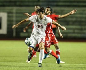 James Joseph Younghusband of the Philippines kicks the ball past his opponent during a friendly match against Bahrain at the Rizal Memorial Stadium in Manila on Friday. PHOTO BY DJ DIOSINA