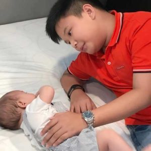 Bimby lovingly looking and touching his baby brother, son of James Yap and Michela Cazzola PHOTO FROM Instagram.com/kriscaquino