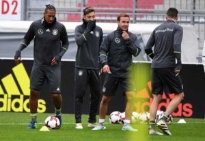 Germany’s midfielder Ilkay Guendogan, Germany’s forward Mario Goetze, Germany’s midfielder Mesut Oezil and Germany’s defender Jerome Boateng warm up during a training session in Hamburg, Germany on Friday prior to the WC 2018 football qualification match between Germany and Czech Republik in Hamburg on October 08. AFP PHOTO