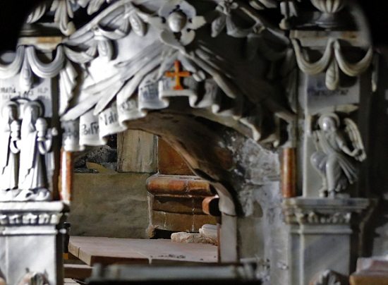 A picture shows the entrance of the Tomb of Jesus at the Church of the Holy Sepulcher under renovation in Jerusalem's Old City. AFP PHOTO 