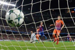 Barcelona’s Argentinian forward Lionel Messi (center) scores a goal beside Manchester City’s defender John Stones (right) during the UEFA Champions League football match FC Barcelona vs Manchester City at the Camp Nou stadium in Barcelona on Thursday. AFP PHOTO