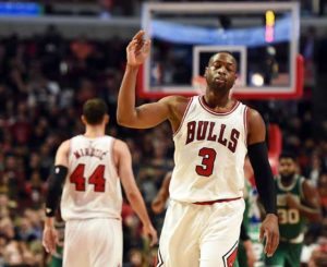 Dwyane Wade No.3 of the Chicago Bulls reacts after a three-point shot during the first half of a game against the Boston Celtics at the United Center on Friday in Chicago, Illinois.  AFP PHOTO 