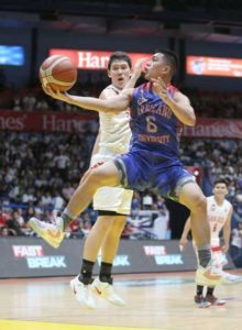 Jiovanni Jalalon of Arellano U scores against Robert Bolick of San Beda College during an NCAA men’s basketball semifinals game at the San Juan Arena. PHOTO BY RUSSELL PALMA