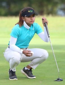 Mikhaela Fortuna lines up her putt during the third round of the 11th Philippine Airlines Ladies Interclub golf team championships at the Camp John Hay  golf course. CONTRIBUTED PHOTO