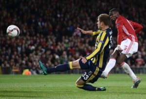 Manchester United’s French midfielder Paul Pogba (R) shoots to score their third goal during the UEFA Europa League group A football match between Manchester United and Fenerbahce at Old Trafford in Manchester, north west England, on Friday.  AFP PHOTO 