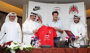 Newly appointed head coach of Qatar league champions al-Rayyan’s football club, Danish Michael Laudrup (second right) poses with his T-shirt next to the team’s manager Ali Salem Afifa (left), the club’s president Sheikh Saud bin Khaled (second left) and the secretary general Abdullah al-Mutawa during a press conference on October 3, 2016 in the capital Doha. Former Barcelona and Real Madrid star Laudrup replaces Jorge Fossati, who was appointed as coach of Qatar’s national team.  AFP photo