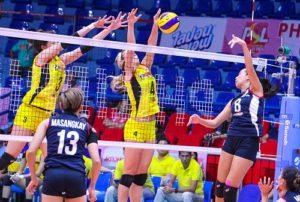 Aiza Maizo-Pontillas of Petron hits the ball over Sydney Kempler and Mika Reyes of F2 in the 2016 Asics Philippine Superliga Grand Prix on Tuesday. CONTRIBUTED PHOTO