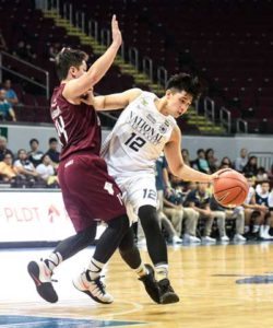 National University’s John Gallego drives on Renzar Asilum of University of the Philippines during a UAAP men’s basketball game at the Mall of Asia in Pasay City on Saturday. PHOTO BY BOB DUNGO JR.