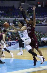 Ricci Rivero of La Salle scores against Christian Moralde of UP during a UAAP men’s basketball game at the Araneta Coliseum on Saturday. PHOTO BY RUSSELL PALMA