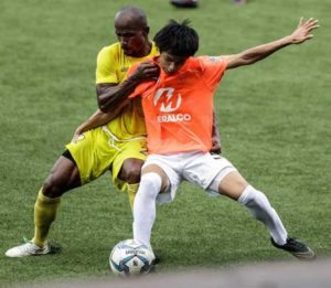 Loyola Meralco Sparks FC winger Kou Ichi Belgira (right) defends the ball in their previous match against leading team Global FC in the second round of the United Football League. UFL MEDIA PHOTO