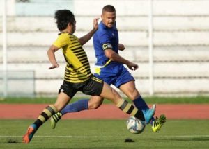 Global FC midfielder Matthew Hartmann (right) works through the defense of Laos FC during their last game in the second round of the 2016 United Football League on Sunday. PHOTO BY UFL MEDIA