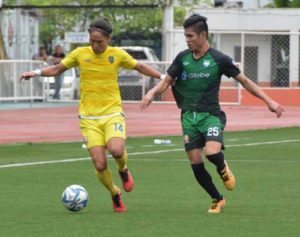 Global FC midfielder Hikaru Minegeshi (left) maneuvers the ball in a game against Green Archers United FC in the United Football League. PHOTO BY JAELLE NEVIN REYES