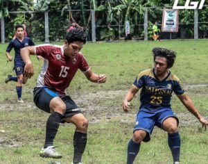 University of the Philippines standout Rvin Resuma (left) battling a National University defender during the elimination round of  Ang Liga first division.   PHOTO FROM  ANG LIGA