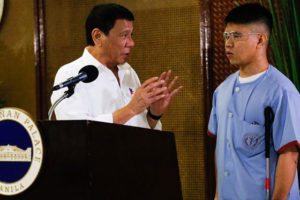RUNNING MAN President Rodrigo Duterte thanks 2nd Lt. Jerome Jacuba in this photo taken in Malacañang last July. Jacuba lost his eyesight  in May in a combat operation in Maguindanao. MALACAÑANG PHOTO