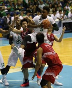 De La Salle University’s Abu Tratter jumps high for a rebound against three University of the East players during the second round of eliminations in the University Athletic Association of the Philippines Season 79 men’s basketball tournament at the Araneta Coliseum. PHOTO BY RENE H. DILAN