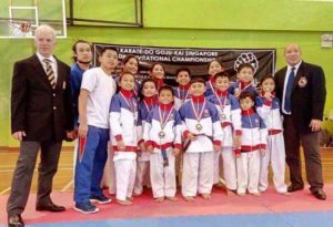 The Association for the Advancement of Karatedo (AAK)-Philippines standouts who won medals in the 36th Karatedo Gojukai Annual Championship held in Singapore. With them are delegation head Richard Anthony Lim and coach Norman Sonny Montalvo. CONTRIBUTED PHOTO