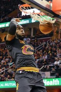 LeBron James of the Cleveland Cavaliers finishes off a fast break with a dunk in the third quarter against the New York Knicks at Quicken Loans Arena in Cleveland, Ohio. AFP PHOTO