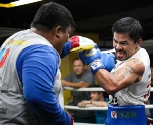 Manny Pacquiao shows explosive power and speed during his mitts training with assistant trainer Buboy Fernandez.  CONTRIBUTED PHOTO