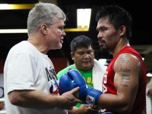 Manny Pacquiao receiving instructions from American trainer Freddie Roach.  CONTRIBUTED PHOTO