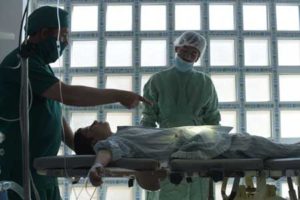 Salang, Parwan, Afghanistan : In this photograph taken on September 21, 2016, Afghan surgeons perform an operation on a patient in an operating rooma at Salang hospital, north of Kabul. AFP / SHAH MARAI