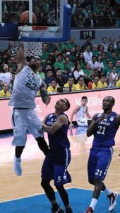 De La Salle University’s Ben Mbala dunks the ball against Manuel Tolentino (No. 5) and Chibueze Ikeh of Ateneo de Manila University during the University Athletic Association of the Philippines Season 79 men’s basketball tournament on Sunday at the Mall of Asia Arena in Pasay City. photo by BOB DUNGO JR.