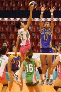Laoag’s Kath Villegas (left) goes for a tip as she goes up against Air Force’s lone blocker in Jocemer Tapic during their Shakey’s V League Season 13 Reinforced Conference clash at the Philsports Arena. CONTRIBUTED PHOTO