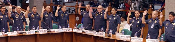 GRILLED Officials of the Philippine National Police take their oath prior to testifying before a joint inquiry into the killing of Albuera, Leyte Mayor Rolando Espinosa, summoned on Thursday by the Senate committees on public order and human rights. PHOTO BY BOB DUNGO JR