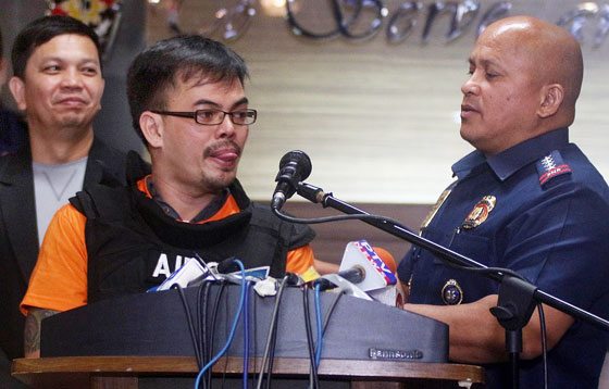 REPATRIATED Eastern Visayas drug kingpin Kerwin Espinosa (left) is presented to the media by Philippine National Police chief Ronald de la Rosa at Camp Crame in Quezon City. PHOTO BY RUY MARTINEZ 