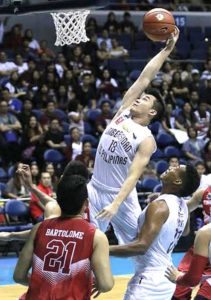 University of the Philippines’ Paul Desiderio grabs a rebound against Wilson Bartolome of University of the East during the University Athletic Association of the Philippines Season 79 men’s basketball tournament on Sunday at the Araneta Coliseum.  BOB DUNGO JR. 