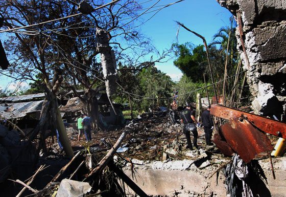 INVESTIGATORS scour through debris at the site of the fireworks factory explosion. PHOTO BY RUY L. MARTINEZ 