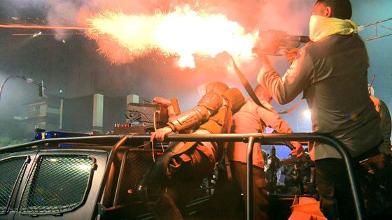 VIOLENT DISPERSAL An Indonesian policeman fires a tear gas canister to disperse Muslim protesters near the presidential palace during clashes after a rally against governor Basuki Tjahaja Purnama, a Christian accused of insulting Islam, in Jakarta on Friday night. AFP PHOTO 