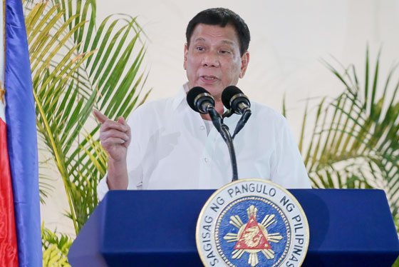 OFF TO PERU President Rodrigo Duterte delivers a speech prior to his departure for the APEC summit in Peru, at the Davao airport on Thursday. Duterte threatened to do a Russia and pull the Philippines out of the International Criminal Court, incensed at foreign criticism of alleged extrajudicial killings in his deadly drug war. AFP PHOTO BY MANMAN DEJETO