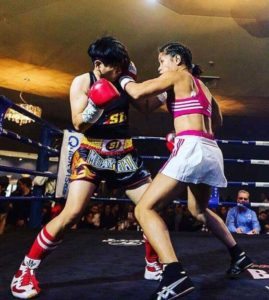 Gretchen Abaniel (right) delivers a left hook to her opponent’s  jaw. CONTRIBUTED PHOTO 