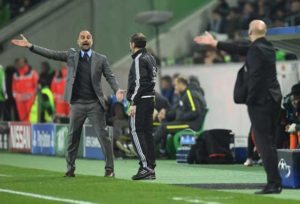 Manchester City’s Spanish manager Pep Guardiola (left) and Moenchengladbach’s head coach André Schubert gesture the UEFA group C Champions League football match between Borussia Moenchengladbach and Manchester City on November 23, in Moenchengladbach, western Germany. AFP PHOTO