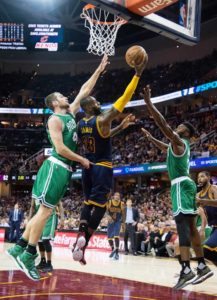 LeBron James No.23 of the Cleveland Cavaliers shoots over Tyler Zeller No.44 and Jaylen Brown No.7 of the Boston Celtics at Quicken Loans Arena on Friday in Cleveland, Ohio. AFP PHOTO 