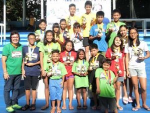 Philippine Swimming League (PSL) President Susan Papa with the Most Outstanding Swimmer awardees in the Class C of the 104th PSL National Series. CONTRIBUTED PHOTO