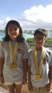 Philippine Swimming League (PSL) standouts Kim Del Rosario (left) and Joey Del Rosario wearing their medals won in the 2016 Guam Youth Games International Swimming Championship.  CONTRIBUTED PHOTO