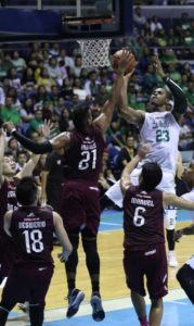 Andrew Harris of UP blocks a shot of Ben Mbala of La Salle during a UAAP men’s basketball game at the Araneta Coliseum.  Photo by Russell Palma