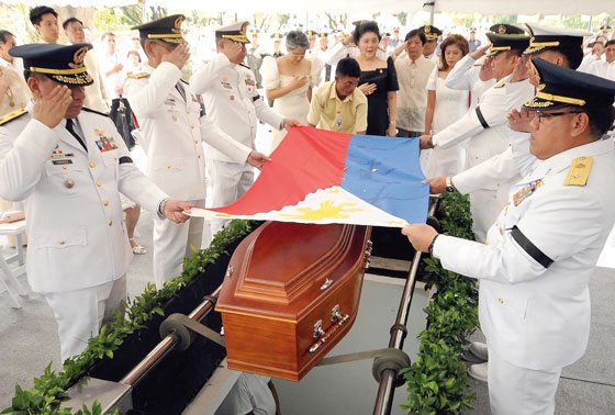 FINAL WISH Members of the family of the late strongman Ferdinand Marcos, led by former first lady Imelda Marcos (in black), watch as military officers salute at the coffin containing the remains of the late former president. It was the supposedly the final wish of Marcos, who fell from power in 1986 and died in exile in Hawaii in 1989. AFP PHOTO