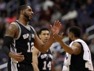 LaMarcus Aldridge (No. 12) of the San Antonio Spurs celebrates during a timeout against the Washington Wizards at Verizon Center in Washington, DC.  AFP PHOTO