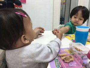 Starting them young: At CCE, children are encouraged to share, as young as 1-year old, so that they learn something about reciprocity and trust.  In photo: Luca shares his snack with Matty 