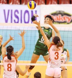 College of Saint Benilde’s Jeanette Panaga goes for a crosscourt hit against San Beda blockers.  FILE PHOTO