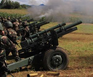 READY, AIM, FIRE Soldiers fire their 105mm howitzer cannons towards enemy positions from their base near Butig town in Lanao del Sur province. AFP photo