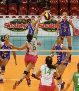 Pocari’s Michelle Gumabao beats Laoag’s Grethcel Soltones for a tip during their Shakey’s V-League Reinforced Conference duel at the Philsports Arena.  CONTRIBUTED PHOTO